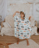 A muslin car print poncho